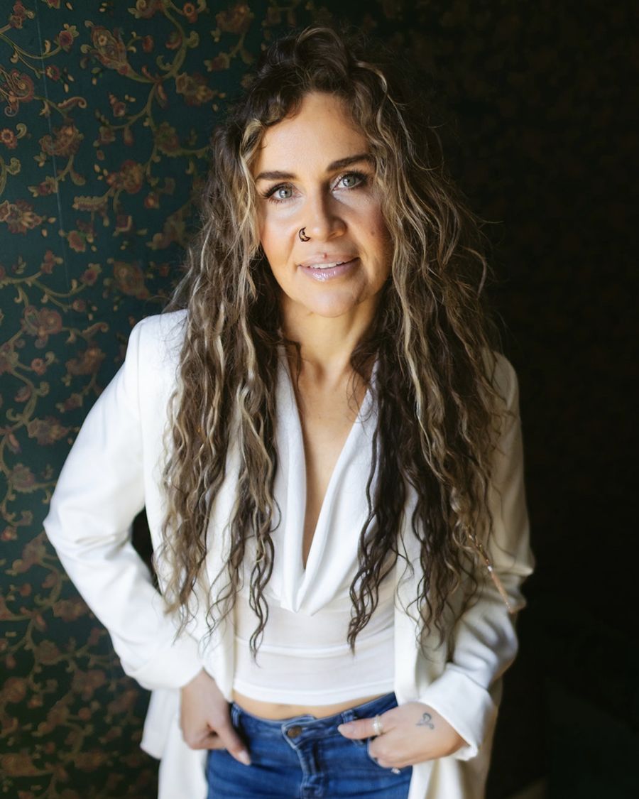 Julia Fisher in a white blazer